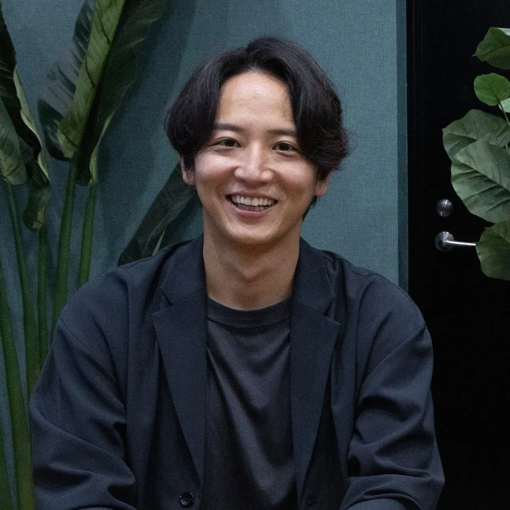 安達 昭典